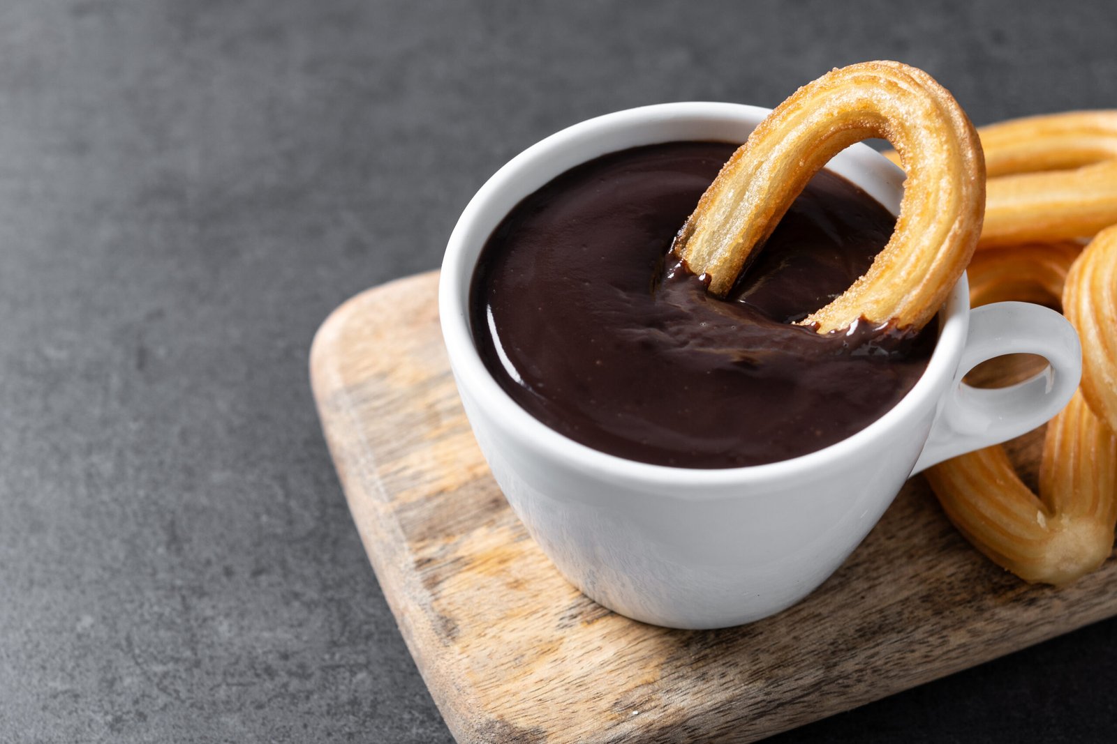 Traditional Spanish Churros With Hot Chocolate On Black Slate Ba
